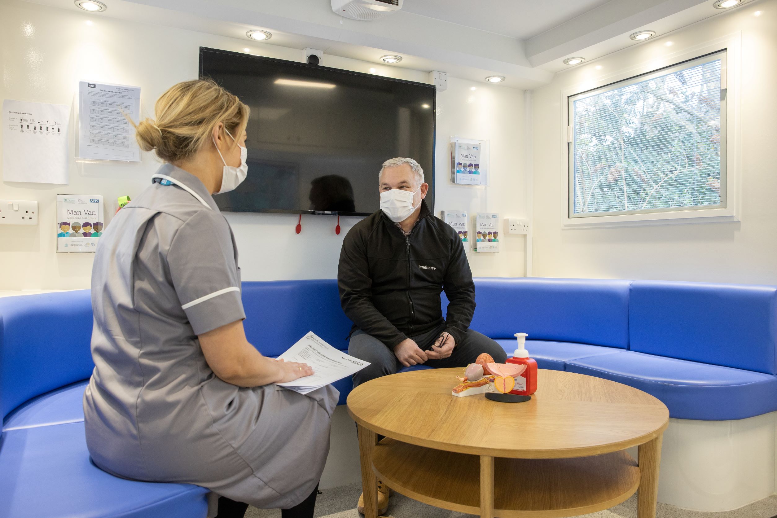 A patient having a consultation in the Man Van.