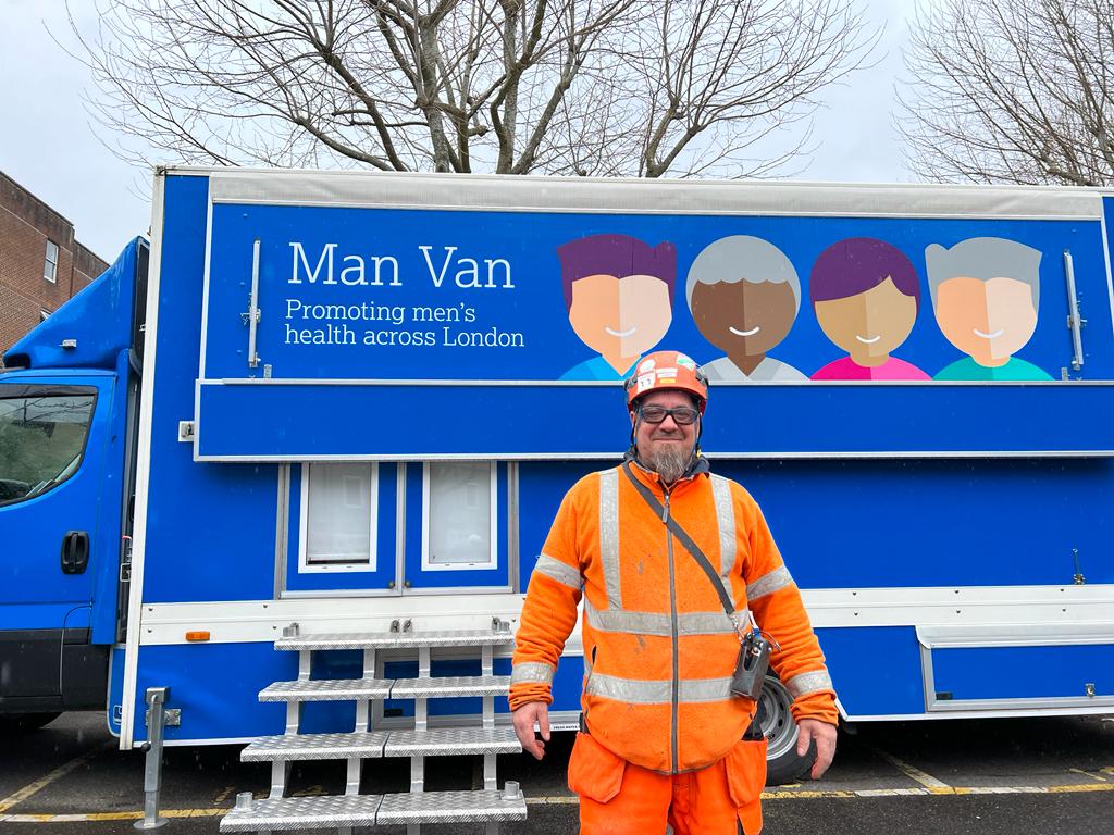 Ernesto Montero in front of the van in Lendlease Ruskin Square construction site